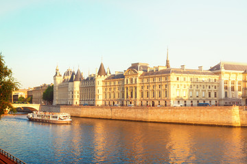Fototapeta na wymiar La Conciergerie - ex royal palace and prison at sunny summer day, Paris, France, retro toned