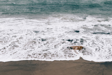 Fototapeta premium Sea waves rolled on shore in winter