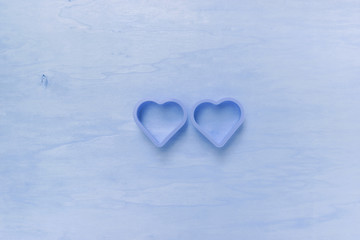 Blue valentine concept, two hearts on wooden background, vintage blue filter