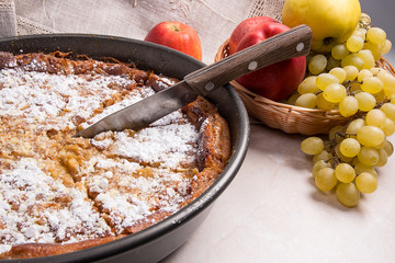 Cheesecake with fresh fruits on light marble background
