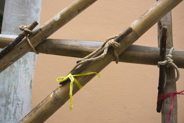 The scaffolding of bamboo lashed together with rope on the wrench.
