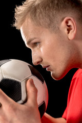 Soccer player holding ball © LIGHTFIELD STUDIOS