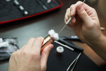 Rebuild vaping device gadget for vaper