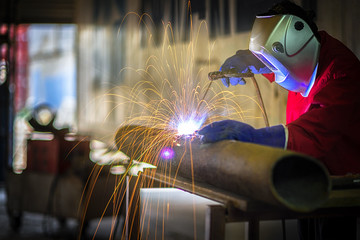 Welder working and carrying jobs of welding pipeline repairing