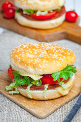 Homemade hamburger with fresh vegetables.