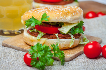 Homemade hamburger with fresh vegetables.
