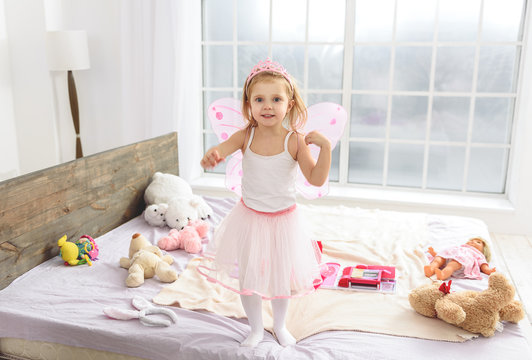 Cute Small Princess Playing In Bedroom