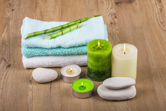 Spa concept /
Spa decoration with candles, towels and spa stones