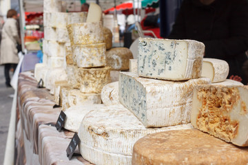 Fototapeta na wymiar French goat cheese in the section. blue cheese. the counter on the French market. Tomme