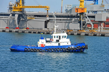 Tugboat and port cargo crane