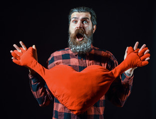 bearded man with heart pillow