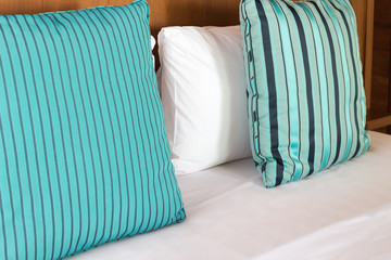 Pillows on comfortable bed  