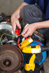 repairman during maintenance work of electric motors