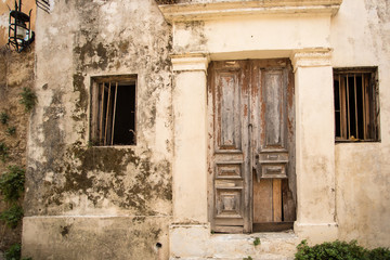 Old wooden door in the wall. Greece, Rhodes