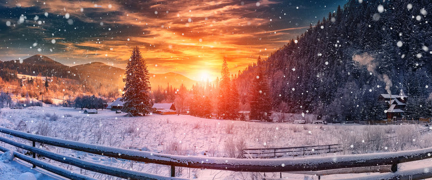 majestic sunset at winter. wonderful wintry view in mountain village. colorful sky over the hills. picturesque amazing scene. christmas concept. instagram toning. creative image.