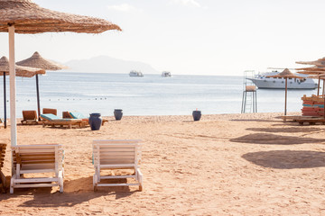 sun umbrellas abd two sunbeds