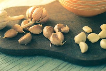 Garlic cloves on a wooden board