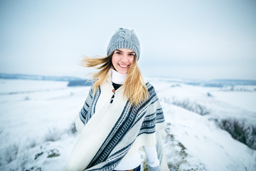 Fototapeta na wymiar Young woman winter portrait. Portrait of happy young woman have fun at beautiful sunny day