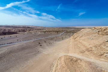 Fototapeta na wymiar Aerial view with a road on Maranjab Desert in Iran