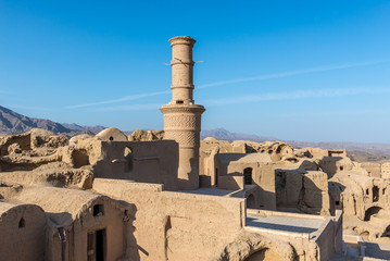Shaking minaret in Abandoned mud brick village of Kharanaq in Iran