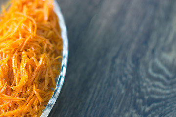 Grated carrot on a wooden board