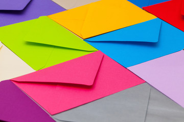 Different colored envelopes on the desk