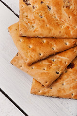 Tasty baked cookies on old wooden background.