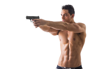 Fototapeta premium Half body Shot of a Handsome Athletic Man with no Shirt Holding a Handgun While Looking to the Left of the Frame. Isolated on White Background.