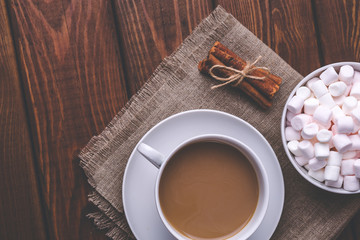 Top view retro toned image of Cup of hot coffee or cocoa, cinnamon 