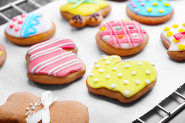 Baking grid with colourful Easter cookies, closeup