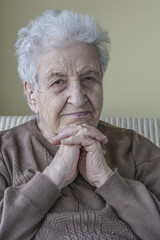 Senior woman leaning on her hands