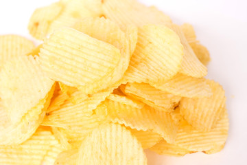 Rippled potato chips on wax paper