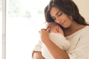 Fototapeten Woman with newborn baby © Trendsetter Images