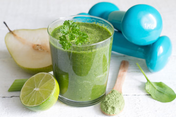 Green smoothie and dumbbells health diet lifestyle concept

