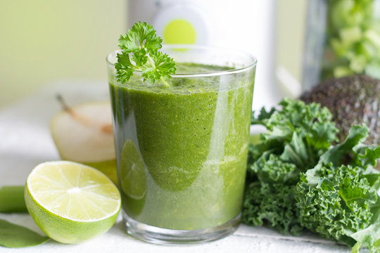 Green smoothie with fruits and vegetables food diet concept
