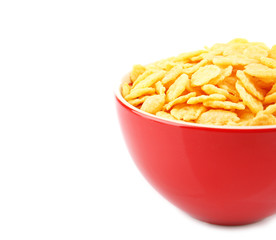 Bowl with cornflakes on white background