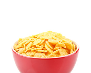 Bowl with cornflakes on white background