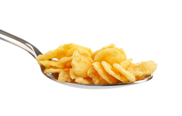 Spoon with cornflakes isolated on white