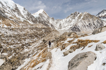 Hikers walking on the trail along Khumbu glacier leading to Everest Base Camp