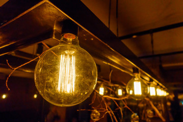 Vintage incandescent lamps as decorative element in a restaurant