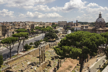 Fototapeta premium Rome overview with monument and several streets, roofs, domes, Coliseum, Imperial Forum, Rome, Italy