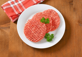 raw hamburger patties