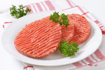 raw hamburger patties