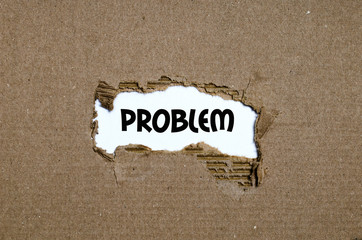 The word problem appearing behind torn paper