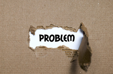 The word problem appearing behind torn paper