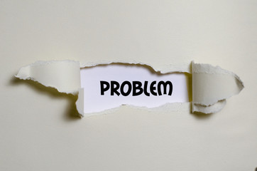 The word problem appearing behind torn paper
