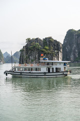 Obraz premium Beautiful landscape of lagoon in the Ha Long Bay (Descending Dragon Bay) at the Gulf of Tonkin of the South China Sea, Vietnam. Tourist boat in a famous Ha Long Bay.