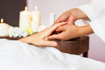 Obraz na płótnie Canvas Woman receiving a hand massage at the health spa.