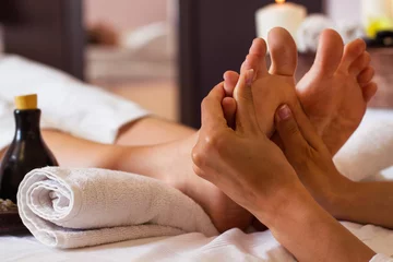 Gordijnen Massage of human foot in spa salon - Soft focus © yatcenko
