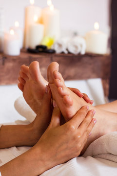 Massage of human foot in spa salon - Soft focus